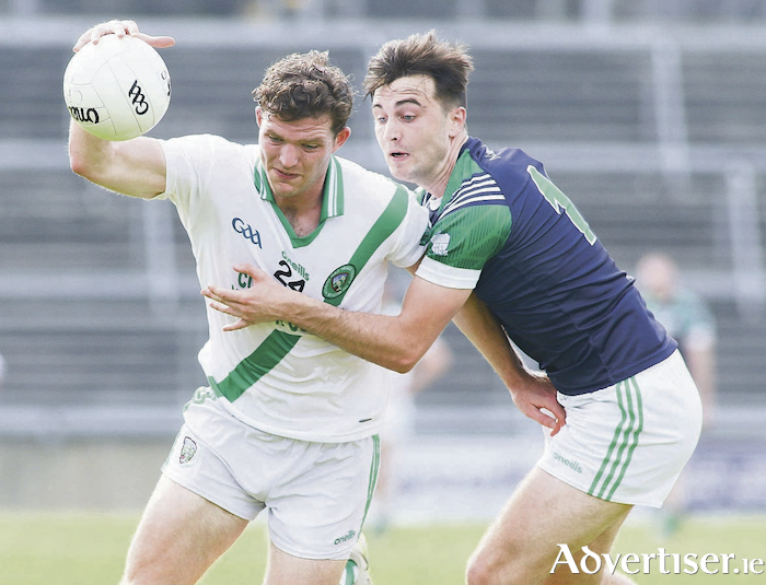 Moycullen's Owen ó Gallchobhán and Oughterard's Eric Lee in action from the Senior Club championship game at Pearse Stadium on Sunday. 
Photo:- Mike Shaughnessy