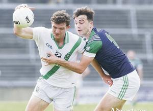 Moycullen&#039;s Owen &oacute; Gallchobh&aacute;n and Oughterard&#039;s Eric Lee in action from the Senior Club championship game at Pearse Stadium on Sunday. 
Photo:- Mike Shaughnessy