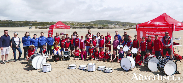 Pictured at the launch of Music Generation’s new percussion bank and percussion programme at Omey Beach were children and young people Pictured at the launch of Music Generation’s new percussion bank and percussion programme at Omey Beach were children and young people participating in a collaborative summer camp delivered by Music Generation Galway County and Forum Connemara CLG. Also pictured are: Cllr. Eileen Mannion (Leas Cathaoirleach, Galway County Council) -Eric Cunningham (Music Development Officer, Music Generation Galway County), Marie Feeney (Adolescent Support Programme Co-ordinator, Forum Connemara CLG) With Music Generation’s Musician Educators  Adam Downey, Fionnuala Hannigan, Shona O’ Flaherty and Colm Brennan.  Photo:- Mike Shaughnessy Pictured at the launch of Music Generation’s new percussion bank and percussion programme at Omey Beach were children and young people participating in a collaborative summer camp delivered by Music Generation Galway County and Forum Connemara CLG. Also pictured are: Cllr. Eileen Mannion (Leas Cathaoirleach, Galway County Council) -Eric Cunningham (Music Development Officer, Music Generation Galway County), Marie Feeney (Adolescent Support Programme Co-ordinator, Forum Connemara CLG) With Music Generation’s Musician Educators  Adam Downey, Fionnuala Hannigan, Shona O’ Flaherty and Colm Brennan.  Photo:- Mike Shaughnessy Eileen Mannion (Leas Cathaoirleach, Galway County Council) -Eric Cunningham (Music Development Officer, Music Generation Galway County), Marie Feeney (Adolescent Support Programme Co-ordinator, Forum Connemara CLG) With Music Generation’s Musician Educators  Adam Downey, Fionnuala Hannigan, Shona O’ Flaherty and Colm Brennan.  Photo:- Mike Shaughnessy