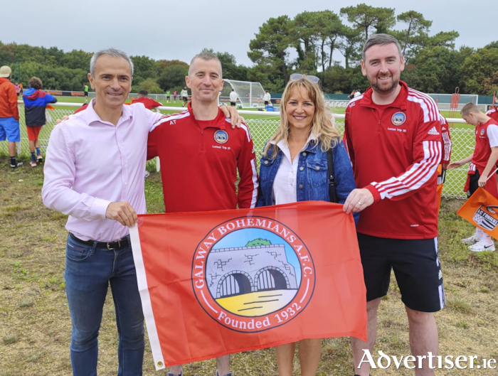 Mike Cubbard and Anthony Trill donate the Bohs club flag to their Lorient hosts.