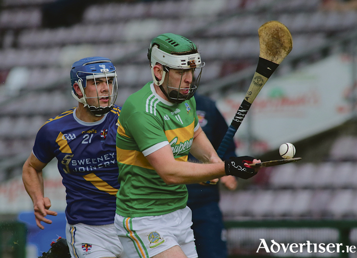 Loughrea's Anthony Burns keeps the pressure on Gort captain Aiden Helebert in action from the Brooks Senior Hurling Championship game at Pearse Stadium on Saturday. Loughrea finished the game 10 point ahead Gort. Photo:- Mike Shaughnessy