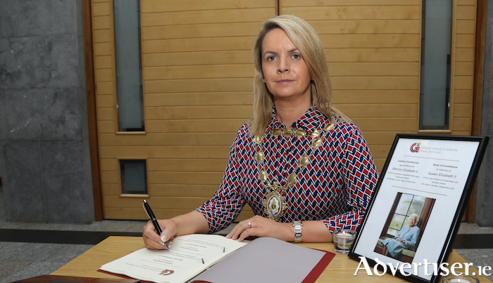 Mayor of the City of Galway, Cllr Clodagh Higgins signing the condolences book in Galway City Hall 