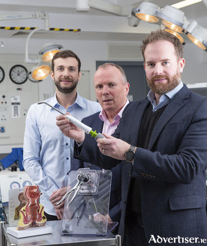 (L-R) Moshe Zilversmit, co-founder and CEO with Signum Surgical scientific advisory board member Mark Regan, Consultant Colorectal Surgeon at University Hospital Galway; and Eoin Bambury, co-founder and chief technology officer who is pictured holding the BioHealx Technology.