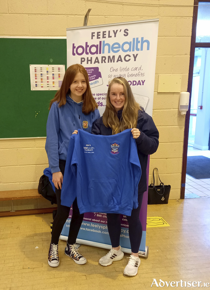 Irish international and Olympic Hockey player Naomi Carroll with Millie Ross,  overall winner of the new club crest competition for Tuam Falcons Hockey Club.
