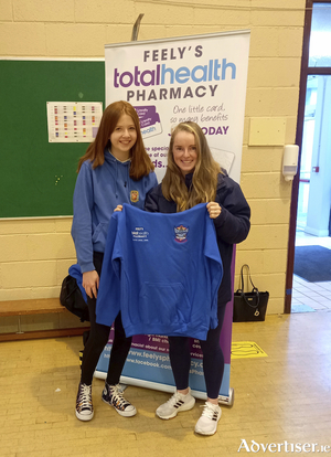 Irish international and Olympic Hockey player Naomi Carroll with Millie Ross,  overall winner of the new club crest competition for Tuam Falcons Hockey Club.

