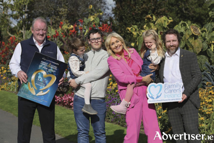 Pictured at the launch of the Netwatch Family Carer of the Year Awards are, from left, Mick Galwey, Netwatch Brand Ambassador and Ireland rugby legend, 2021 Young Carer of the Year recipient Evan Corbally and his sisters, Rose (5) and Aoibhín Martin (3), Miriam O’Callaghan and Ruaidhrí Kelly, Family Carers Ireland. PHOTO: Mark Stedman
