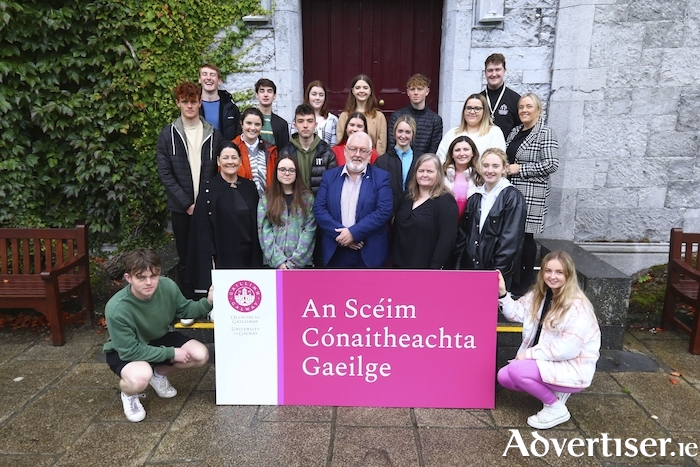 Pictured are the sixteen students who have secured accommodation in Teach na Gaeilge, in Corrib Village on the University of Galway campus for the 2022-2023 academic year through the Irish Language Residential Scheme. Also pictured are Michelle Ní Chróinín, director of strategy and planning; Professor Pól Ó Dochartaigh, University of Galway deputy president and registrar; Dorothy Ní Uigín, Acadamh na hOllscolaíochta Gaeilge; Caroline Ní Fhlatharta, Oifigeach na Gaeilge; and Barry Ó Siochrú, Students’ Union. 
Photo: Mike Shaughnessy.