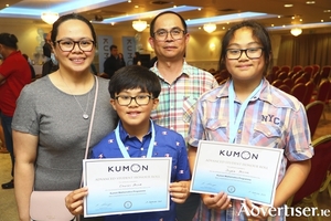 Charles and Jayven Dizon of Loughrea with their parents Christina and Juanito at the Kumon awards ceremony in the Menlo Park Hotel recently. 