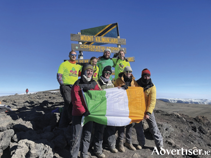 Athlone native, Doireann Langan (third from right, front row), is pictured at the summit of Mount Kilimanjaro, following her trek for charity in August
