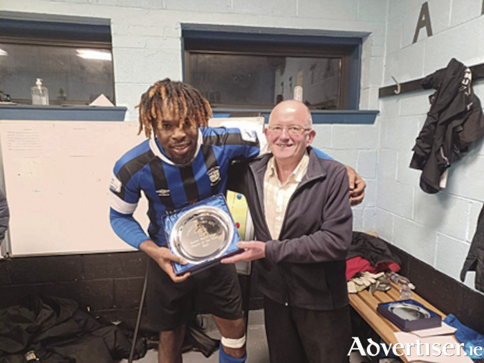 Athlone Town striker, Thomas Oluwa, is presented with his local media ‘Player of the Year’ award by Athlone Advertiser freelance journalist, John Dingle