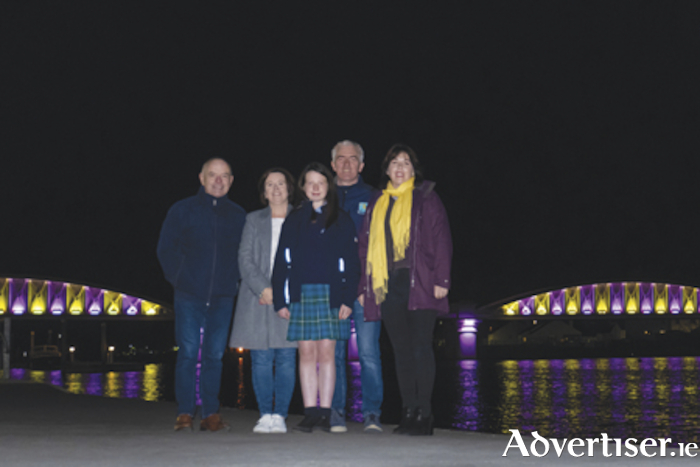 Our Lady’s Bower student, Sarah Dungan, is pictured with her mother Karen, father, Jimmy, Cllr Frankie Keena and Clare Carroll as the white bridge in the heart of Athlone was illuminated to raise awareness of Development Language Disorder (DLD) Day