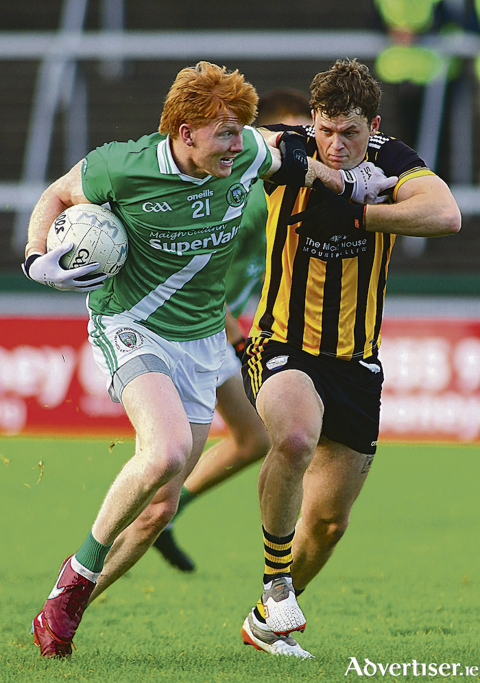 Moycullen's Peadar Ó Cuaig fends off Michael Daly of Mountbellew Moylough in  the Bons Secours Galway Senior Football Championship semi-final at Pearse Stadium on Sunday. Photo:- Mike Shaughnessy