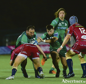 Connacht&#039;s  Jack Aungier  with Dylan Tierney Martin in support clash with Scarlets&#039; Ryan  Elias in the URC game in the Sportsground on Friday  night. 
Photo:- Mike Shaughnessy