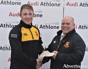 Oisin McCormack is presented with his Audi &lsquo;Man of the Match&rsquo; award by Buccaneers president, Billy McMickan