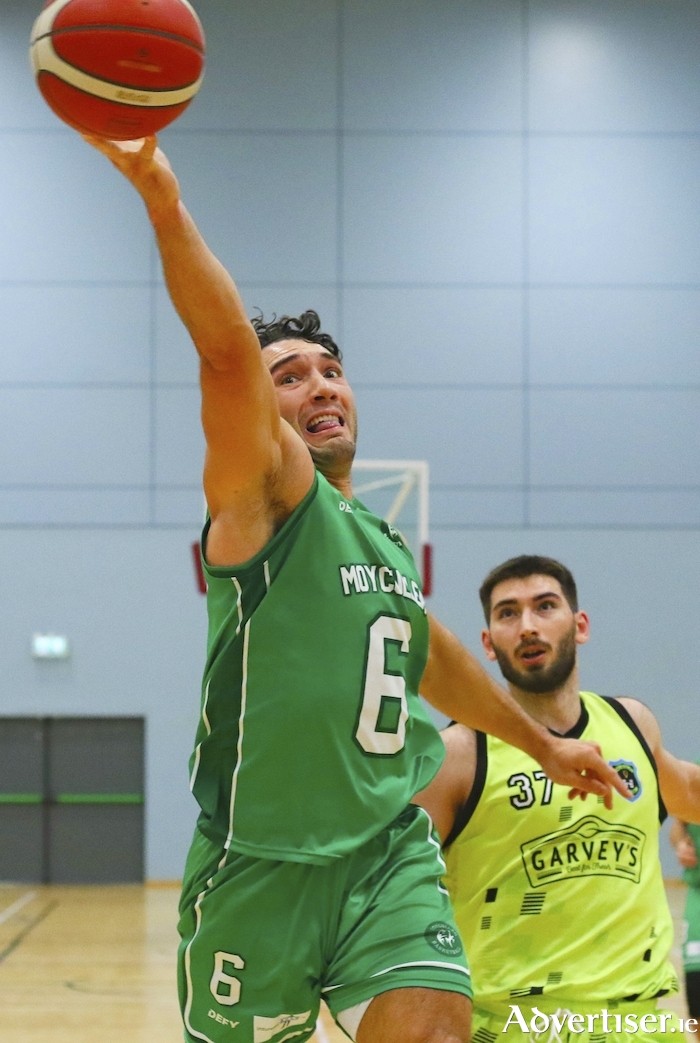 Looking to upset the odds: Moycullen's Grant Olsson on his way to shot,  watched by Matija Jokic of Garvey's Tralee Warriors in action from the InsureMyVan.ie Superleague game at Kingfisher on Saturday. Photo:- Mike Shaughnessy