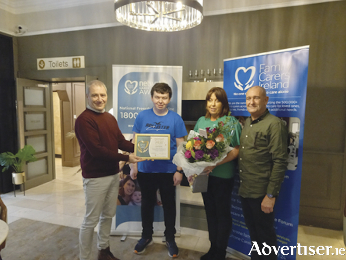 
Athlone native, Lisa Malone, has been honoured with the prestigious ‘Family Carer of the Year’ 2022 accolade.  Lisa is pictured with her son Conor (second from left), husband Pat (right) and Paul Farrell, Community Support Manager for Longford and Westmeath, Family Carers Ireland 
