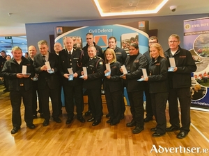 Mayo Civil Defence volunteers pictured at a ceremony in Croke Park this week, attended by the Minister for Defence &amp; Foreign Affairs, Simon Coveney, who paid special tribute to Civil Defence volunteers and officers for their work during the Covid-19 pandemic. The volunteers each received a special Covid-19 medal for undertaking duties during the height of the pandemic. 
