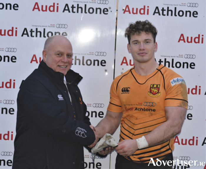 Scorer of four tries in Buccaneers win over Banbridge, Josh O’Connor receives his AUDI ‘Man of the Match’ award from club president, Billy McMickan
