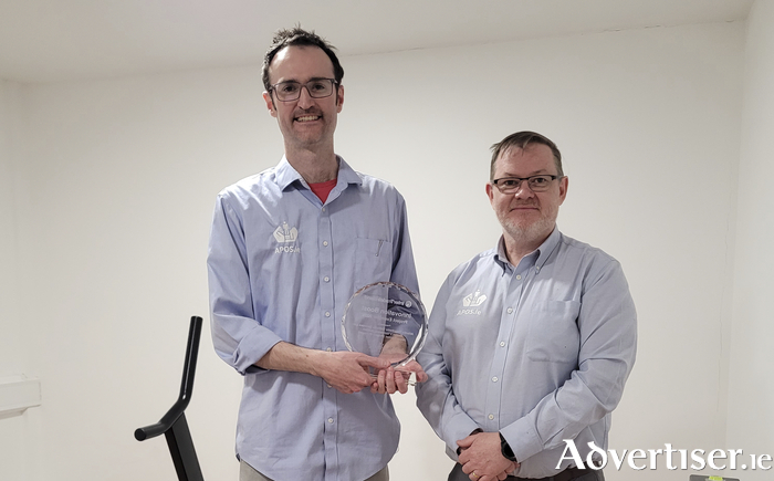 Atlantic Prosthetic Orthotic Solutions with an Innovation Boost award recognising "outstanding innovation."  Pictured (l-r)  holding the trophy is graduate Jason Benton who is now a full-time employee with the company and  Darren Matthews General Manager of APOS.
