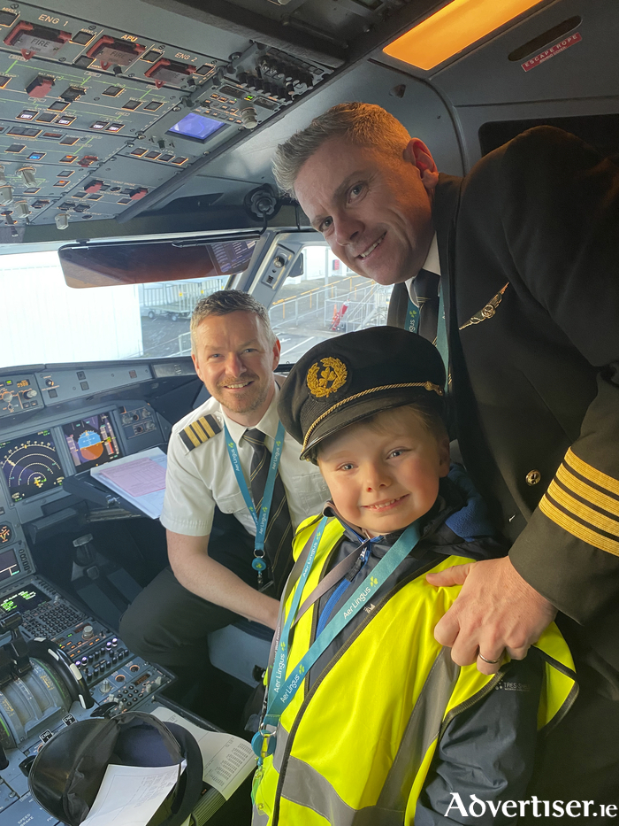 Aron gets into the cockpit with the Aer Lingus pilots.