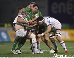 Luke Marshall of Ulster is tackled by Dave Heffernan of Connacht during the United Rugby Championship match between Connacht and Ulster at The Sportsground in Galway. 
