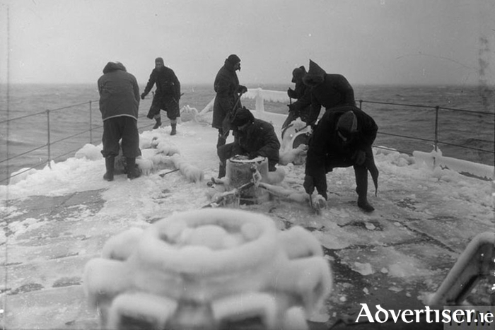 Clearing the decks of ice in the North Atlantic.