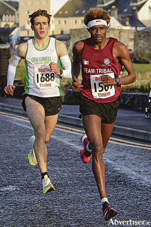 Eventual winner Patrick Noonan, Craughwell AC Ieft) tracking Abaas Edris  of Castlegar AC in the Resolution Run  5k.  Photo: John O&#039;Connor