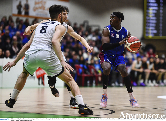Jarett Haines of University of Galway Maree in action against Stefan Desnica, 8, and Alex Dolenko of DBS Eanna during the Basketball Ireland Pat Duffy National Cup Final match between DBS ?anna and University of Galway Maree at National Basketball Arena in Tallaght, Dublin.  
