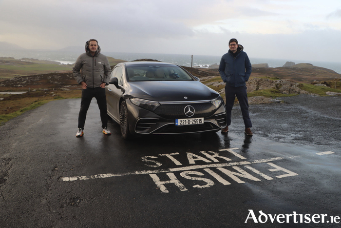 Paddy Comyn (left) and Blake Boland (right) at Malin Head in Donegal. Driving the Mercedes-Benz EQS 450+, they completed the Mizen Head to Malin Head drive on one full battery, without stopping to charge. 