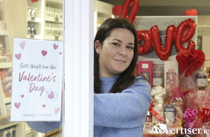 Burning love - Simona Cacciapuoti of the Yankee Candle shop on Abbey Gate St, arranges their Valentine&#039;s Day window display. Photo:-Mike Shaughnessy 
