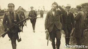 A member of the anti-Treaty forces being taken prisoner by the Free State Army.