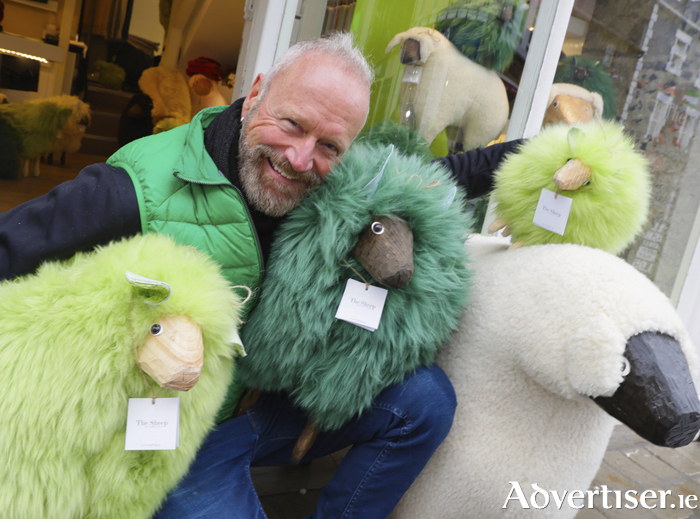 Ewe better believe it — Raytus Gassner with some of the limited edition sheep he created for St Patrick’s Day. The cuddlygreen pets can be seen grazing at The Sheep Shop, MainguardStreet. Photo:- Mike Shaughnessy