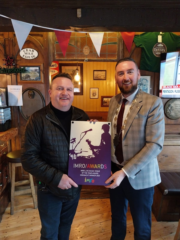 Monroe's owner, Gary Monroe displaying the 'Connacht Live Music Venue of the Year 2023' award with Deputy Mayor, Cllr Mike Cubbard. 