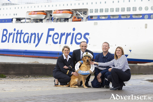 Reuben the dog is pictured with Captain Christophe Bergeroux and members of the Brittany Ferries team with the Salamanca which sails twice weekly between Rosslare Europort and Bilbao in Spain. 
Photograph: Patrick Browne