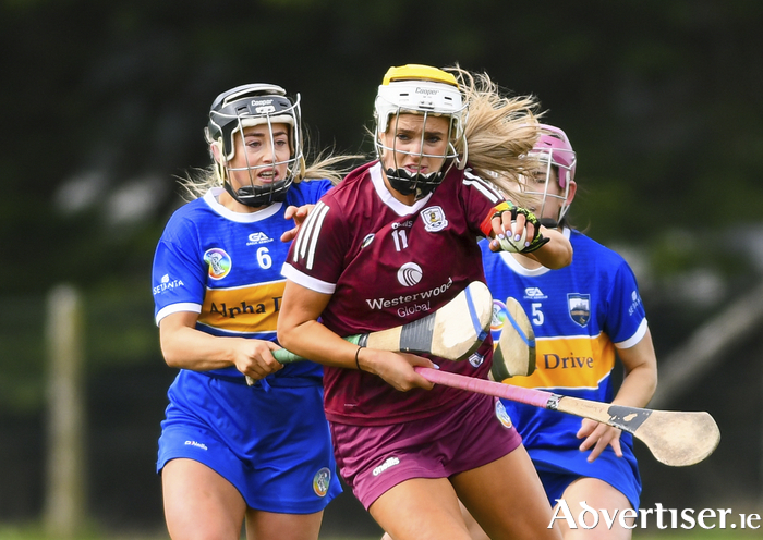 Galway's Ava Lynskey under pressure from Lisa Cahill and Ciannait Walsh of Tipperary