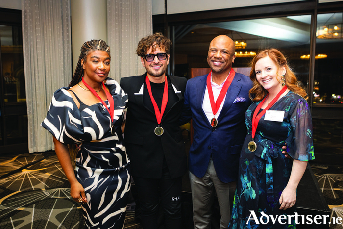 Aime Doherty (R) with honorees (L-R) Courtney Harrell, Torres and Quinton Morris. 