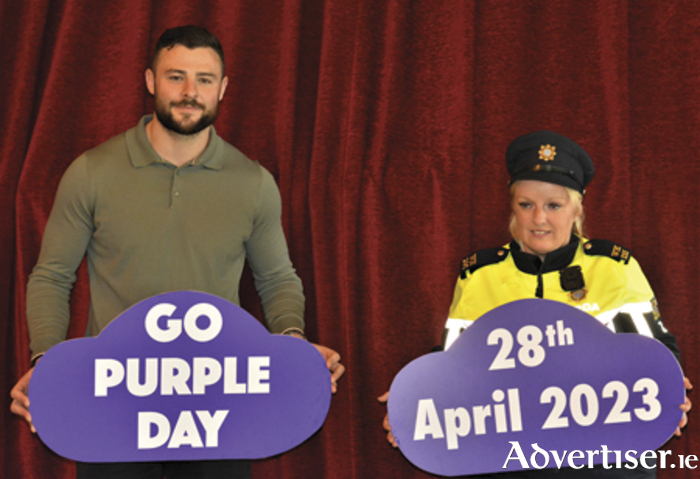 Ireland rugby international, Robbie Henshaw with Garda Stacey Looby, promoting Go Purple Day this Friday, April 29. 