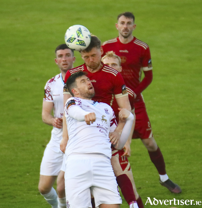 Galway United's Rob Slevin wins a mid air duel with Cobh Ramblers' Jake Hegarty in action from the SSE Airtricity League game at Eamonn Deacy Park on Friday night. 
Photo:- Mike Shaughnessy 