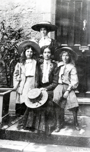 Emily&rsquo;s mother Gertrude is seated with Emily standing on left, and her sister Elsie seated right. Standing behind is Elisa Curtet, the children&rsquo;s Swiss governess. The photograph was taken outside their living quarters at University College Galway. 
