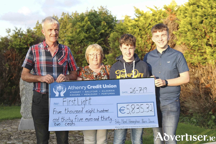 The Heneghan Family, L-R Paddy, Bernie, Seán and Gerard with a cheque for FirstLight with the proceeds of the 2019 Baby Noel Heneghan Barn Dance. 