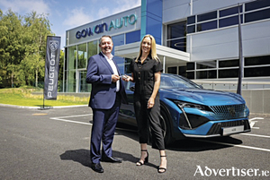 Pictured in front of the new Peugeot 408 is Des Cannon, managing director at Gowan Auto, Peugeot importers in Ireland, and Kathryn Thomas.