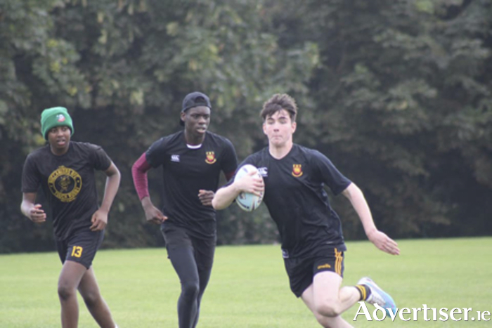 Buccaneers Boys, Dion Chitanda, Philip Finnan and Cian Copelin, are pictured in action during their game with DSC Wanderers