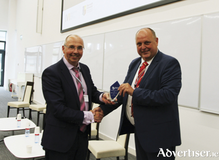 Esteemed TUS Athlone Professor, Neil Rowan, receives his merited award from Professor Markus Helfert, IVI Summit coordinator