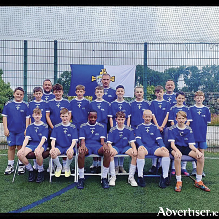 Pictured are the St John’s Athletic Under 13 management and playing squad who claimed shield success at the renowned Foyle Cup competition in Derry this past weekend