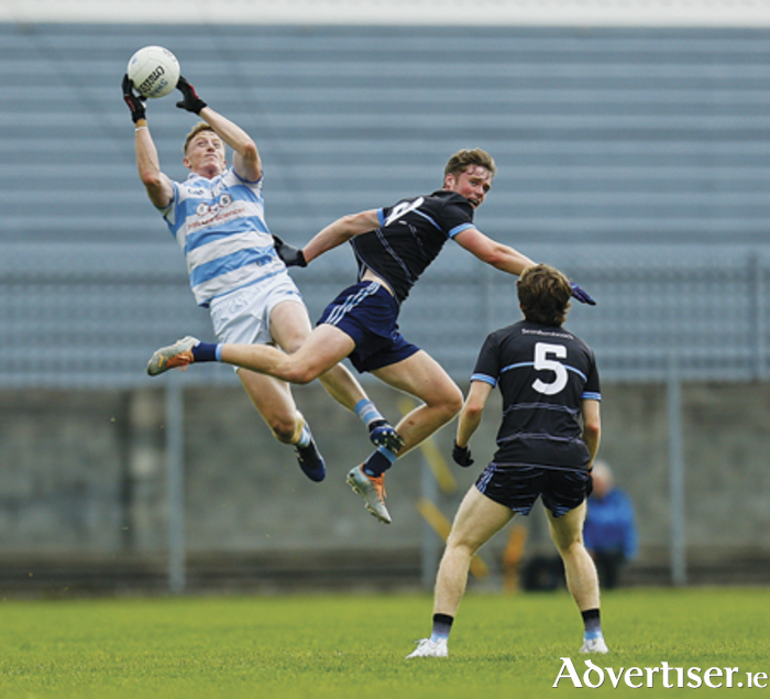 Ray Connellan catches a high ball under pressure from Darren McWade and Adam Treanor as Athlone earned a vital win over Shandonagh in the Westmeath senior football championship on Sunday in TEG Cusack Park.  Photograph by Ashley Cahill.