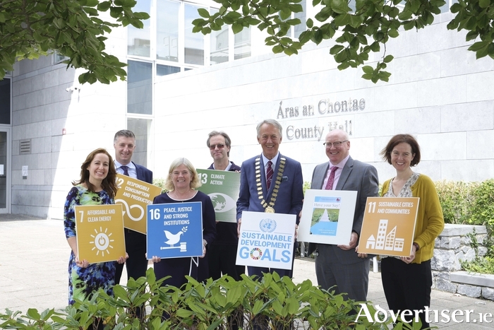 From left: Tina Ryan, climate action coordinator; Liam Hanrahan, director of services; Marie Mannion, heritage officer; Cllr Alastair McKinstry, chair of Climate and Biodiversity SPC; Cllr Liam Carroll, Cathaoirleach; Liam Conneally, chief executive; Rosina Joyce, biodiversity officer.