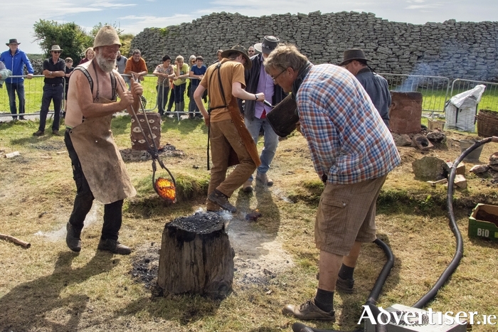 Blacksmiths and traditional iron smelters pictured during the inaugural Caherconnell International Furnace Festival in 2022.