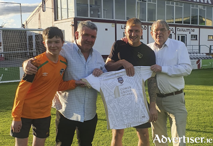 Daire Grant, Gerry Daly, Stephen Walsh, and Paddy Grant with a signed United jersey to be raffled in aid of Lakeview School in honour of the late Dave Daly.