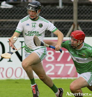 Sarsfields&#039; captain Kevin Cooney is challenged by Castlegar&#039;s Sean Neary in action from the Brooks Galway Senior Club Hurling Championship game at Kenny Park, Athenry on Sunday. Photo: Mike Shaughnessy