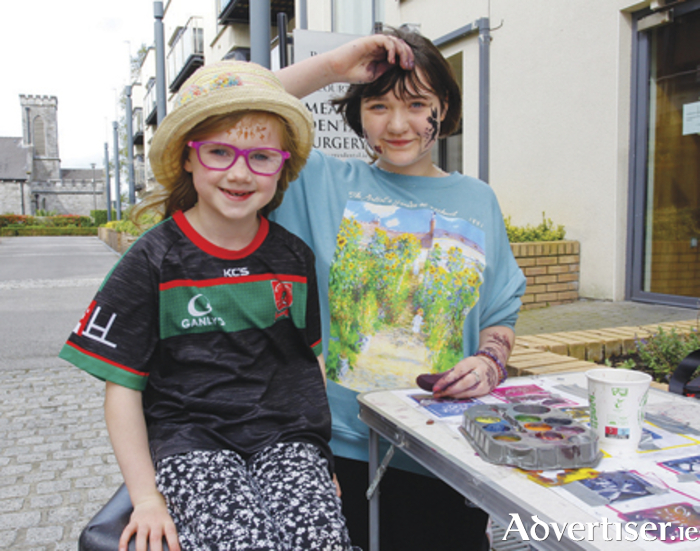 Meabh Cahill gets her face painted by Blaithin Mullally during the party hosted by the Connaught Street and Environs Traders and Residents Group to mark the culmination of Heritage Week 2023.  Photograph by Ashley Cahill Images.